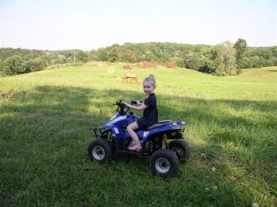 Chase on her 4-wheeler